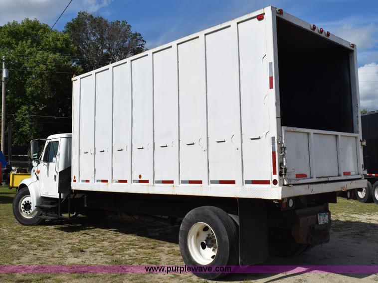 image for item K6657 1999 International 4700 dump bed chipper truck