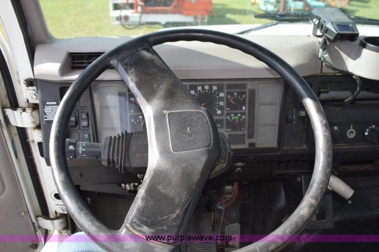 image for item K6657 1999 International 4700 dump bed chipper truck