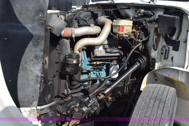 image for item K6657 1999 International 4700 dump bed chipper truck