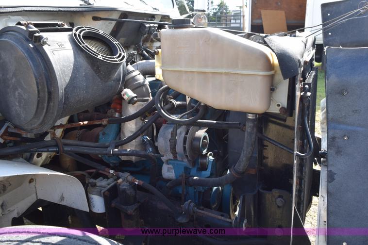 image for item K6657 1999 International 4700 dump bed chipper truck