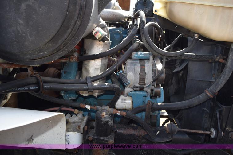 image for item K6657 1999 International 4700 dump bed chipper truck