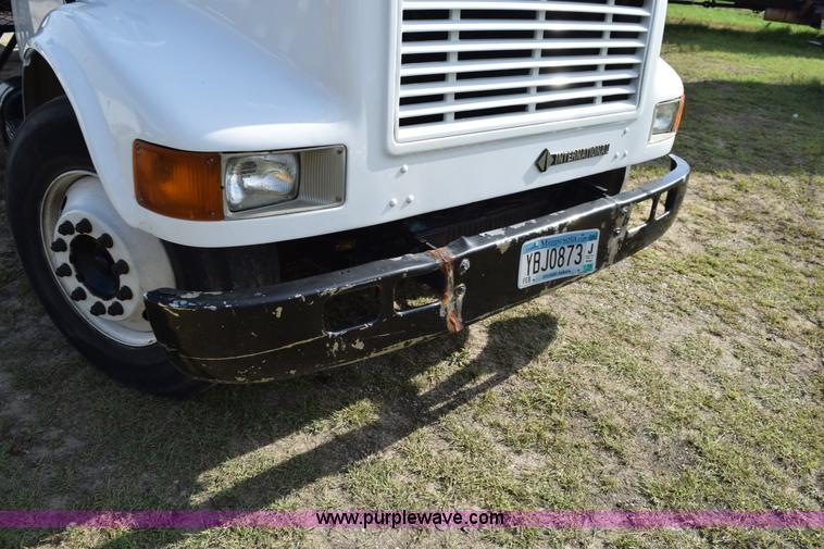 image for item K6657 1999 International 4700 dump bed chipper truck