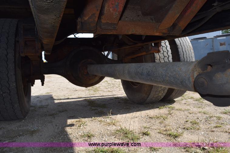 image for item K6657 1999 International 4700 dump bed chipper truck