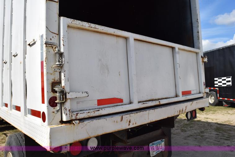 image for item K6657 1999 International 4700 dump bed chipper truck