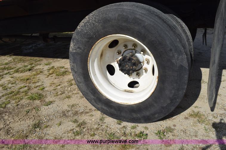 image for item K6657 1999 International 4700 dump bed chipper truck