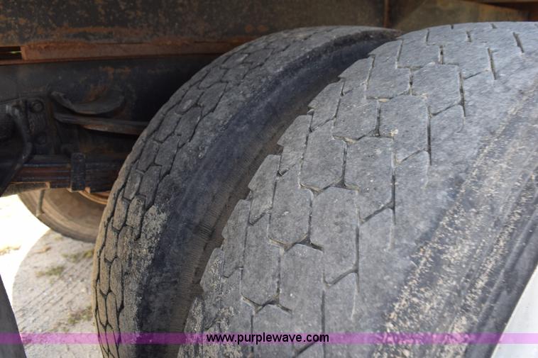 image for item K6657 1999 International 4700 dump bed chipper truck