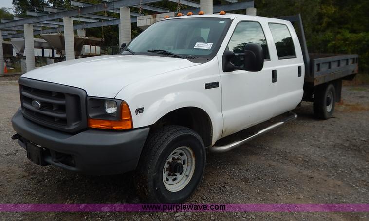 image for item J6380 2000 Ford F350 Crew Cab flatbed pickup truck