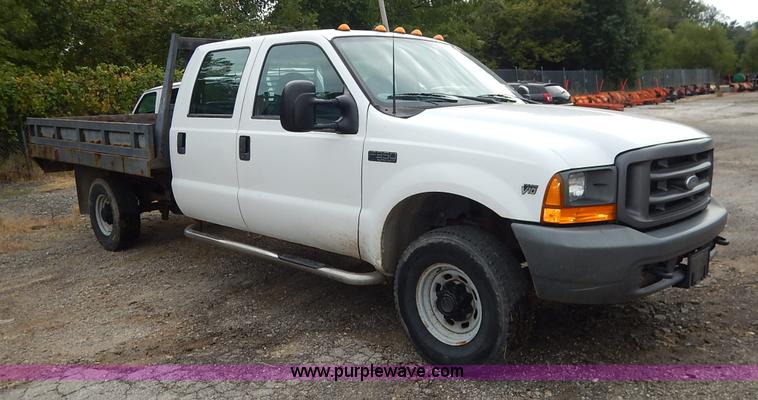 image for item J6380 2000 Ford F350 Crew Cab flatbed pickup truck