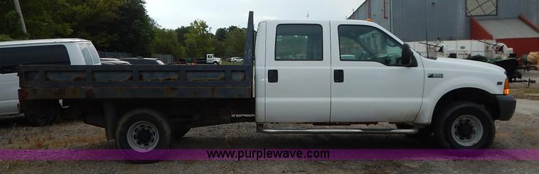 image for item J6380 2000 Ford F350 Crew Cab flatbed pickup truck