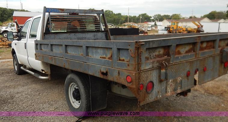 image for item J6380 2000 Ford F350 Crew Cab flatbed pickup truck