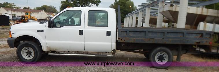 image for item J6380 2000 Ford F350 Crew Cab flatbed pickup truck