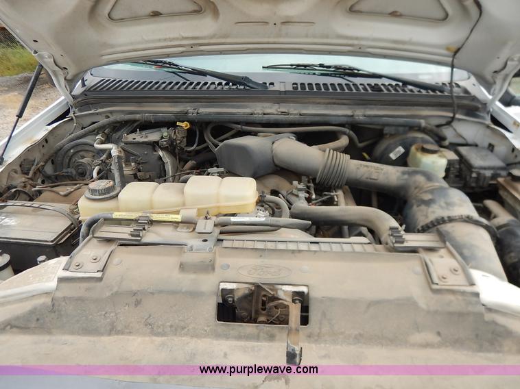 image for item J6380 2000 Ford F350 Crew Cab flatbed pickup truck