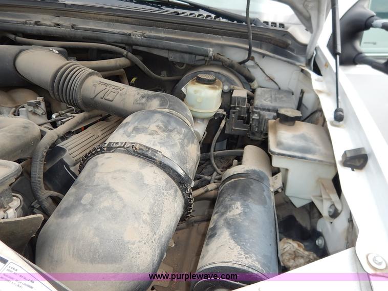 image for item J6380 2000 Ford F350 Crew Cab flatbed pickup truck