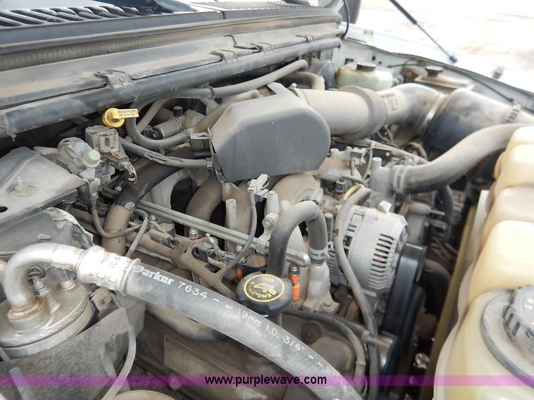 image for item J6380 2000 Ford F350 Crew Cab flatbed pickup truck