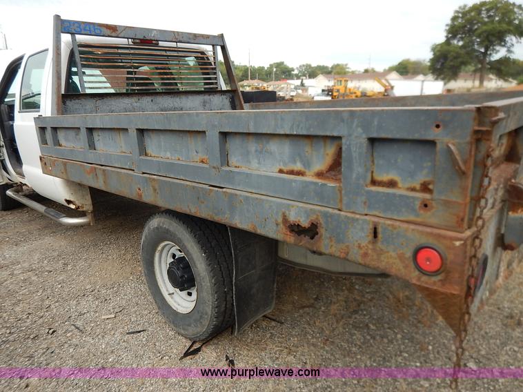 image for item J6380 2000 Ford F350 Crew Cab flatbed pickup truck