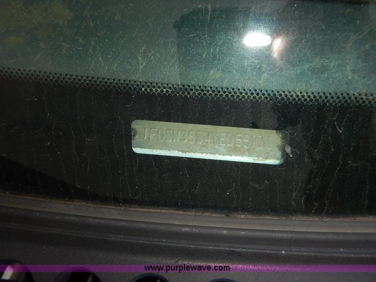 image for item J6380 2000 Ford F350 Crew Cab flatbed pickup truck