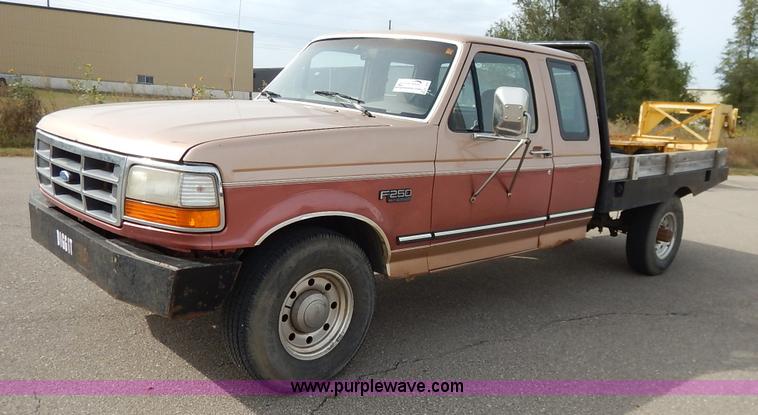 image for item K1695 1994 Ford F250 HD XLT SuperCab flatbed pickup truck