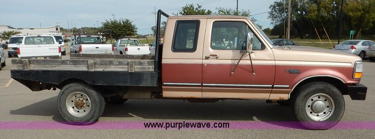 image for item K1695 1994 Ford F250 HD XLT SuperCab flatbed pickup truck