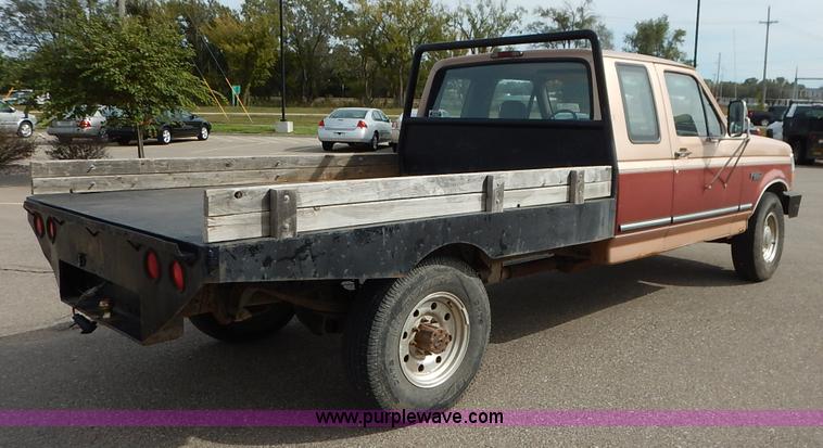 image for item K1695 1994 Ford F250 HD XLT SuperCab flatbed pickup truck