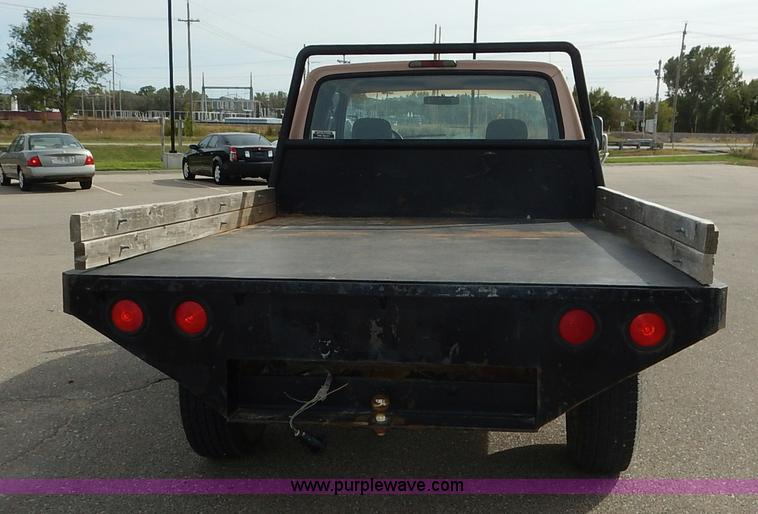 image for item K1695 1994 Ford F250 HD XLT SuperCab flatbed pickup truck