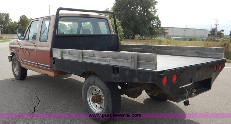 image for item K1695 1994 Ford F250 HD XLT SuperCab flatbed pickup truck