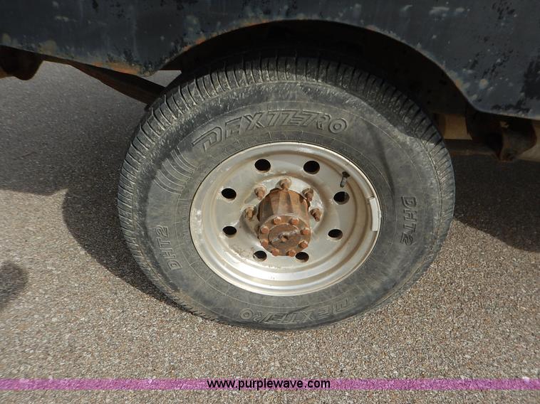 image for item K1695 1994 Ford F250 HD XLT SuperCab flatbed pickup truck