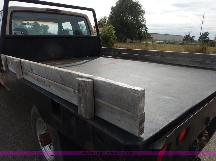 image for item K1695 1994 Ford F250 HD XLT SuperCab flatbed pickup truck