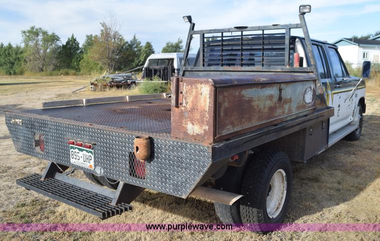 image for item L5003 1986 Ford F350 Crew Cab flatbed pickup truck