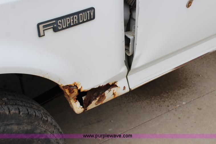 image for item J3628 1997 Ford F450 Super Duty dump flatbed truck