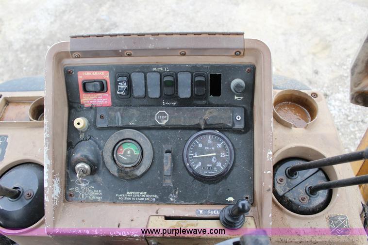 image for item J4370 2000 John Deere 310SE backhoe