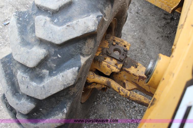 image for item J4370 2000 John Deere 310SE backhoe