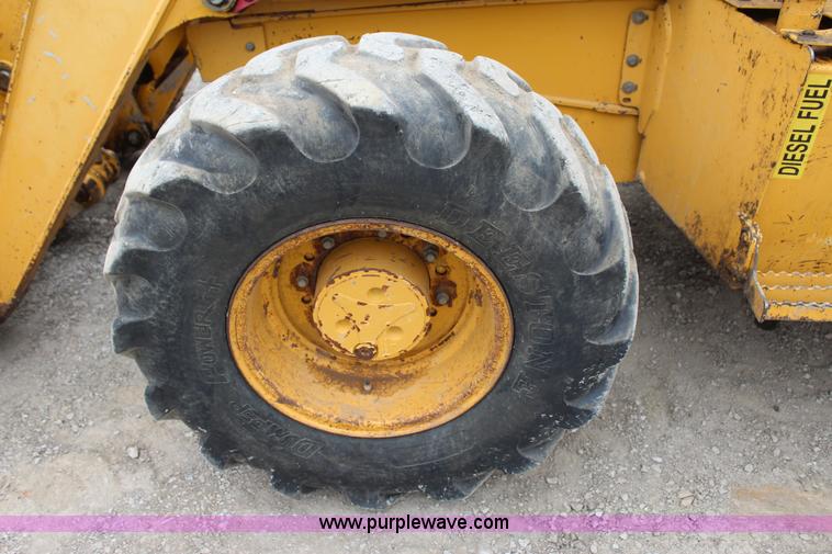 image for item J4370 2000 John Deere 310SE backhoe