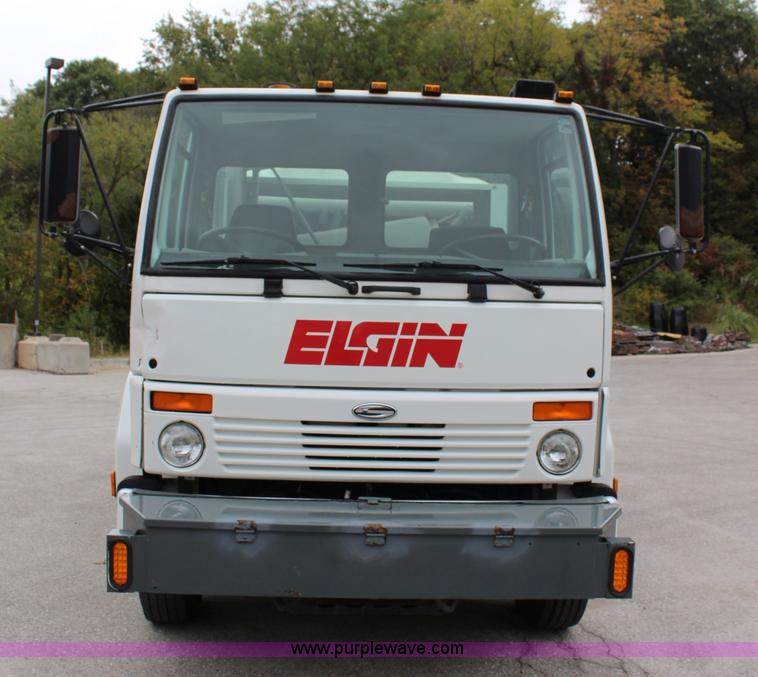 image for item J3711 2006 Sterling truck with Elgin Whirlwind MV vacuum air sweeper