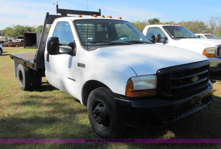image for item I1940 1999 Ford F350 Super Duty flatbed pickup truck