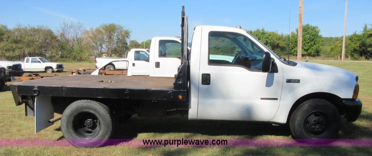 image for item I1940 1999 Ford F350 Super Duty flatbed pickup truck