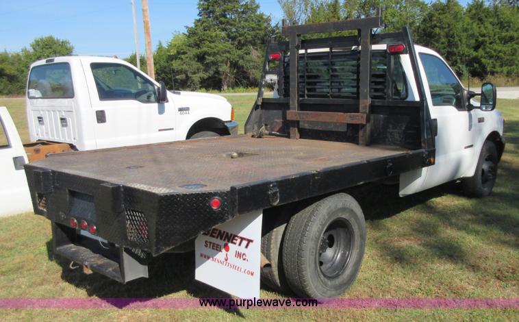 image for item I1940 1999 Ford F350 Super Duty flatbed pickup truck