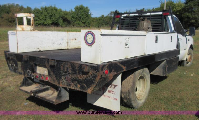 image for item I1944 2001 Ford F350 Super Duty flatbed pickup truck