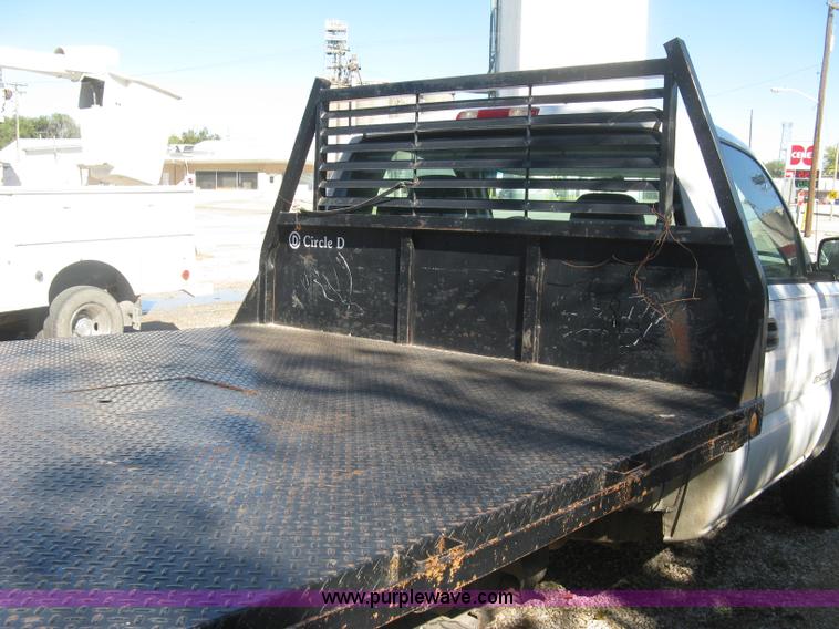 image for item J7879 2004 Chevrolet Silverado 2500HD flatbed pickup truck