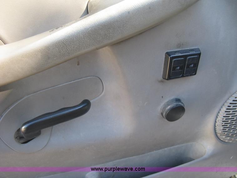 image for item J7879 2004 Chevrolet Silverado 2500HD flatbed pickup truck