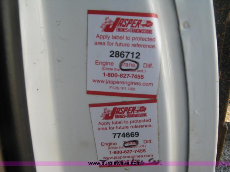 image for item J7879 2004 Chevrolet Silverado 2500HD flatbed pickup truck