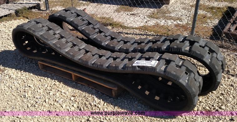 image for item K1223 John Deere 323E skid steer tracks