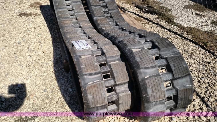 image for item K1223 John Deere 323E skid steer tracks