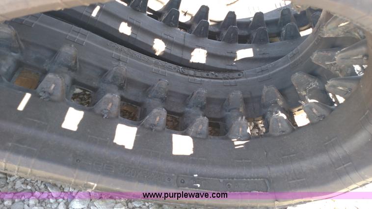 image for item K1223 John Deere 323E skid steer tracks