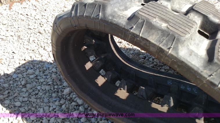 image for item K1223 John Deere 323E skid steer tracks