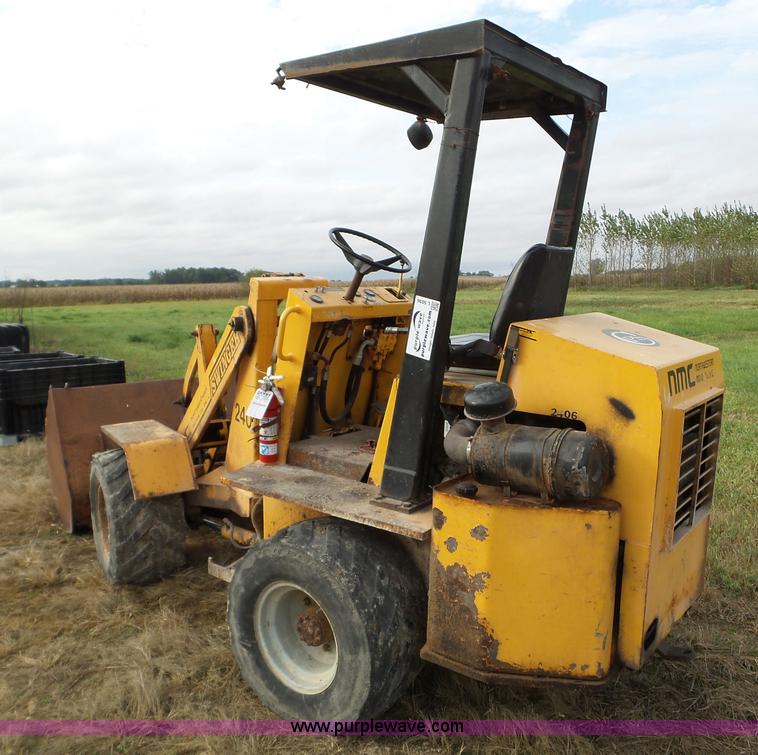 image for item L5036 1994 NMC Swinger 240 wheel loader