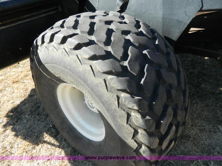 image for item K8208 1997 MacDon 9300 self-propelled windrower