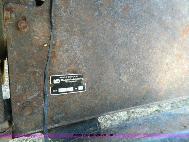 image for item K8208 1997 MacDon 9300 self-propelled windrower