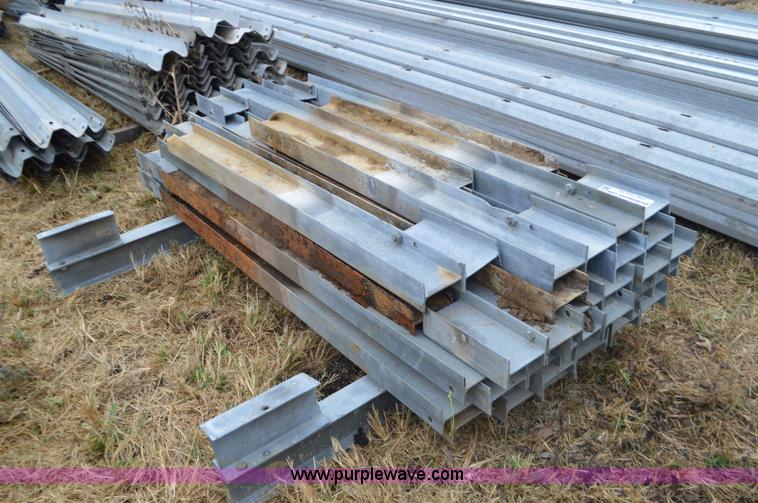 image for item I6351 Approximately 32 guard rail posts