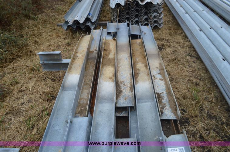 image for item I6351 Approximately 32 guard rail posts