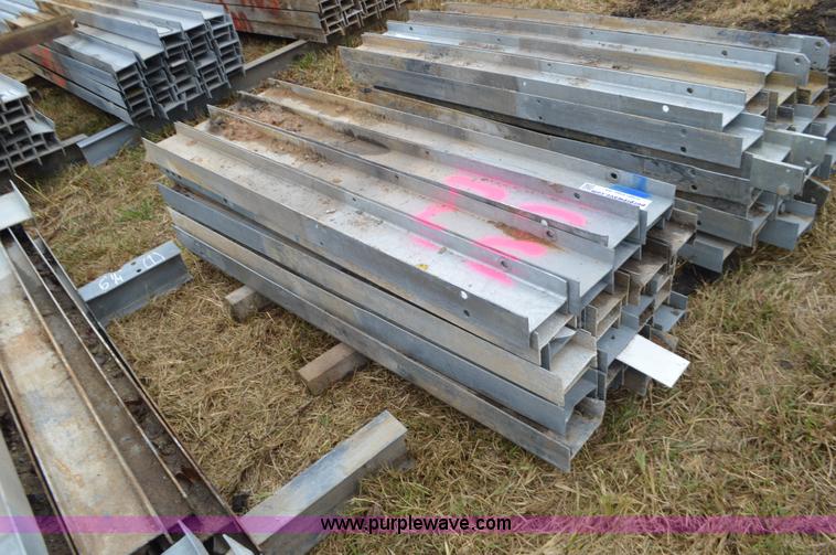 image for item I6355 Approximately 32 guard rail posts